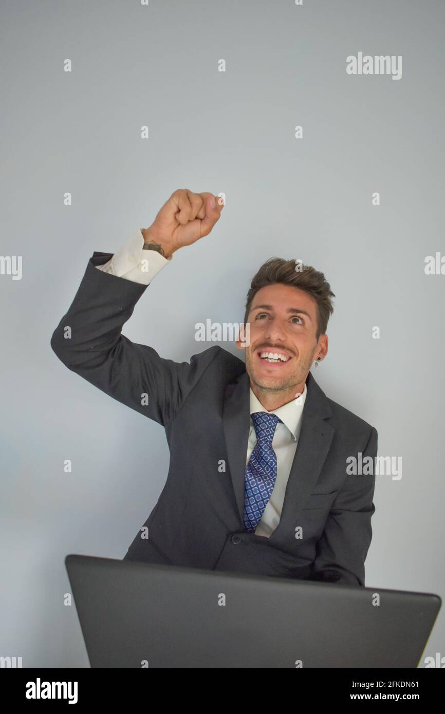 Successfully Dealt Vertical shot of a Caucasian businessman extremely happy for ...