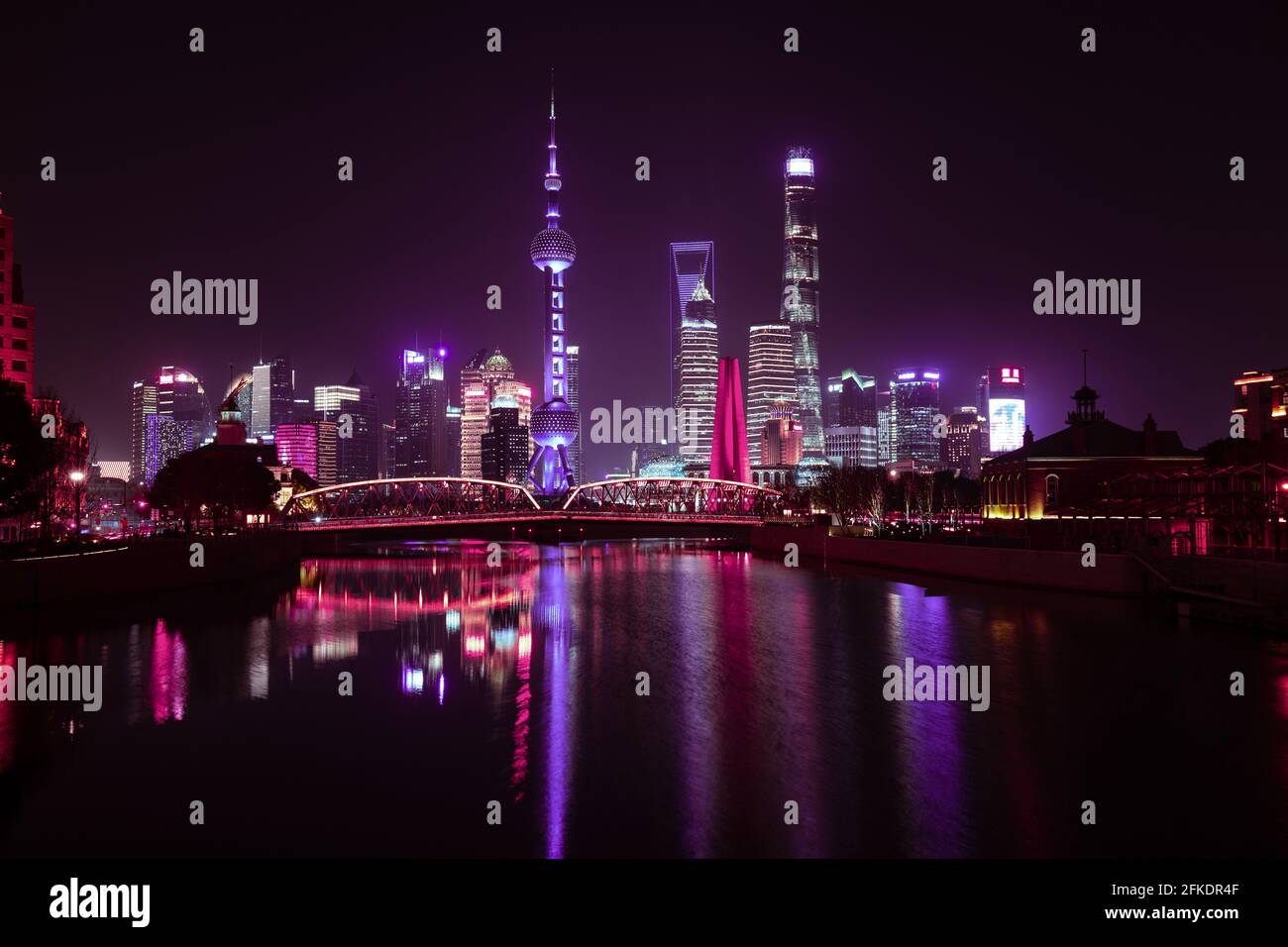 Pudong skyline in Shanghai at night with reflections in water beautiful lights Stock Photo