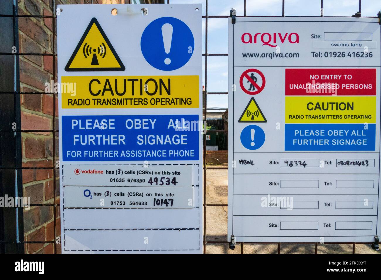 Radio transmitter caution and warning signs on the gate to the Swains Lane broadcasting tower, Highgate, London, U.K. Stock Photo