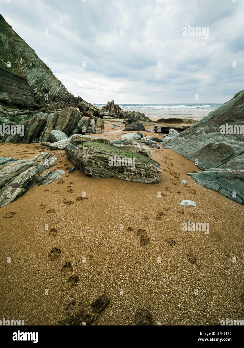 Beautiful shot of large rocks at a calm peaceful white sand beach Stock ...