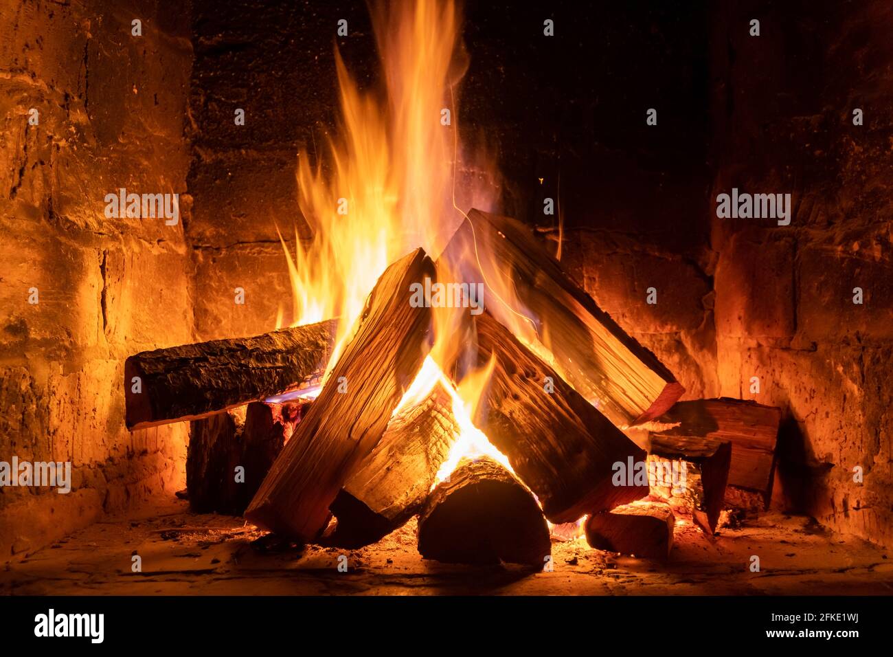 A fire burns in a fireplace, Fire to keep warm. Winter time Stock Photo ...