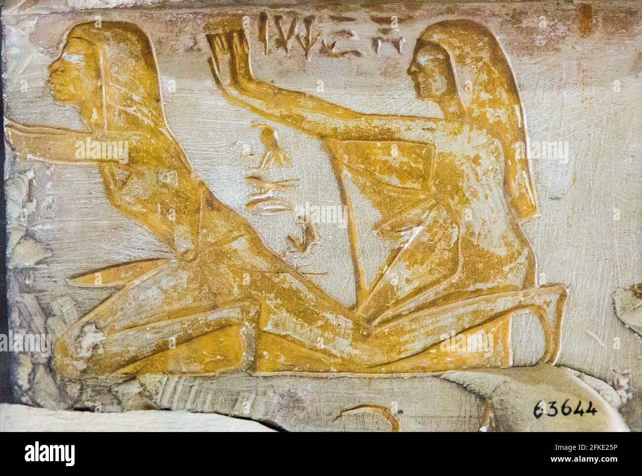 Cairo, Egyptian Museum, two fragment of a lintel : A man and his wife Tauret in praying attitude. Stock Photo