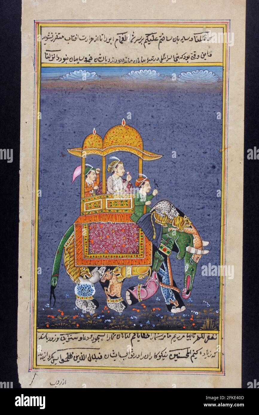 Rajasthani miniature painting from Rajasthan, India.  Probably late 19th century or early 20th century.  A man of rank riding on an elephant with an a Stock Photo