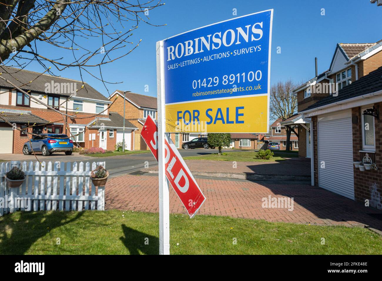 Estate agent house sold sign In the  suburb High Throston in Hartlepool . Stock Photo