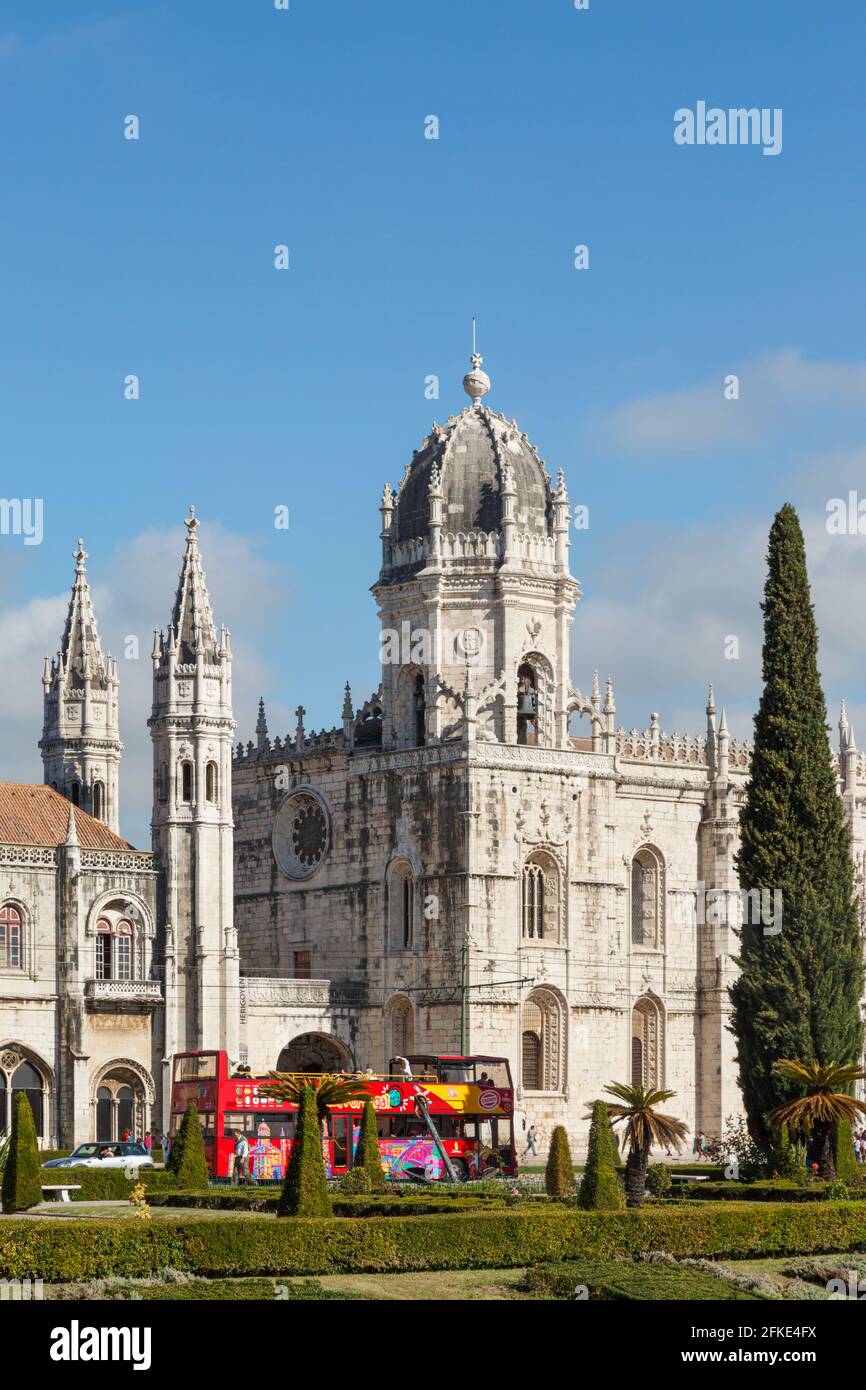 Lisbon, Portugal.  Tourist excursion bus outside the Mosteiro dos Jeronimos, or the Monastery of the Hieronymites. The monastery is considered a trium Stock Photo