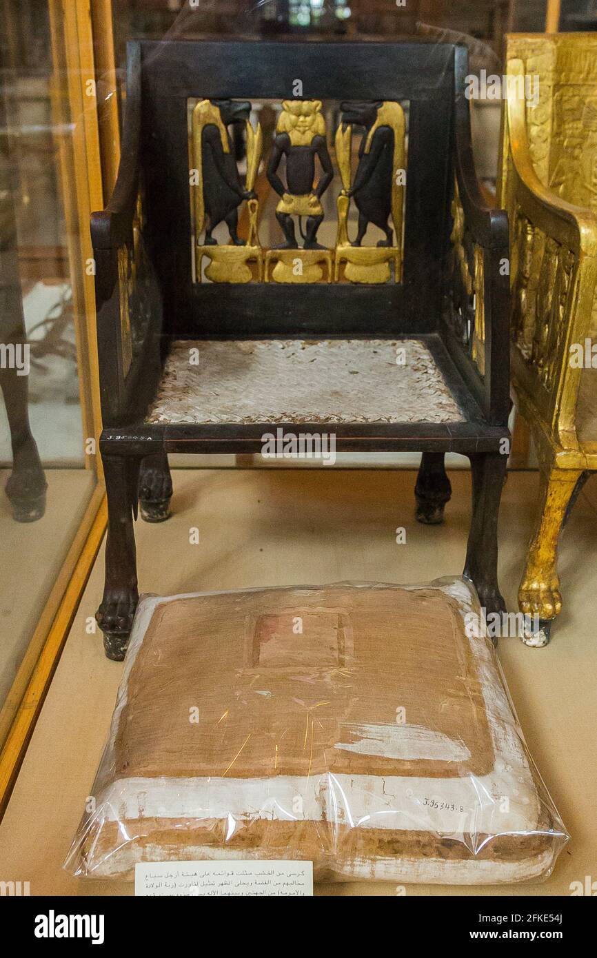 Egypt, Cairo, Egyptian Museum, from the tomb of Yuya and Thuya in Luxor : Wooden chair, painted and gilded. The feet are lion paws, in silver. Stock Photo