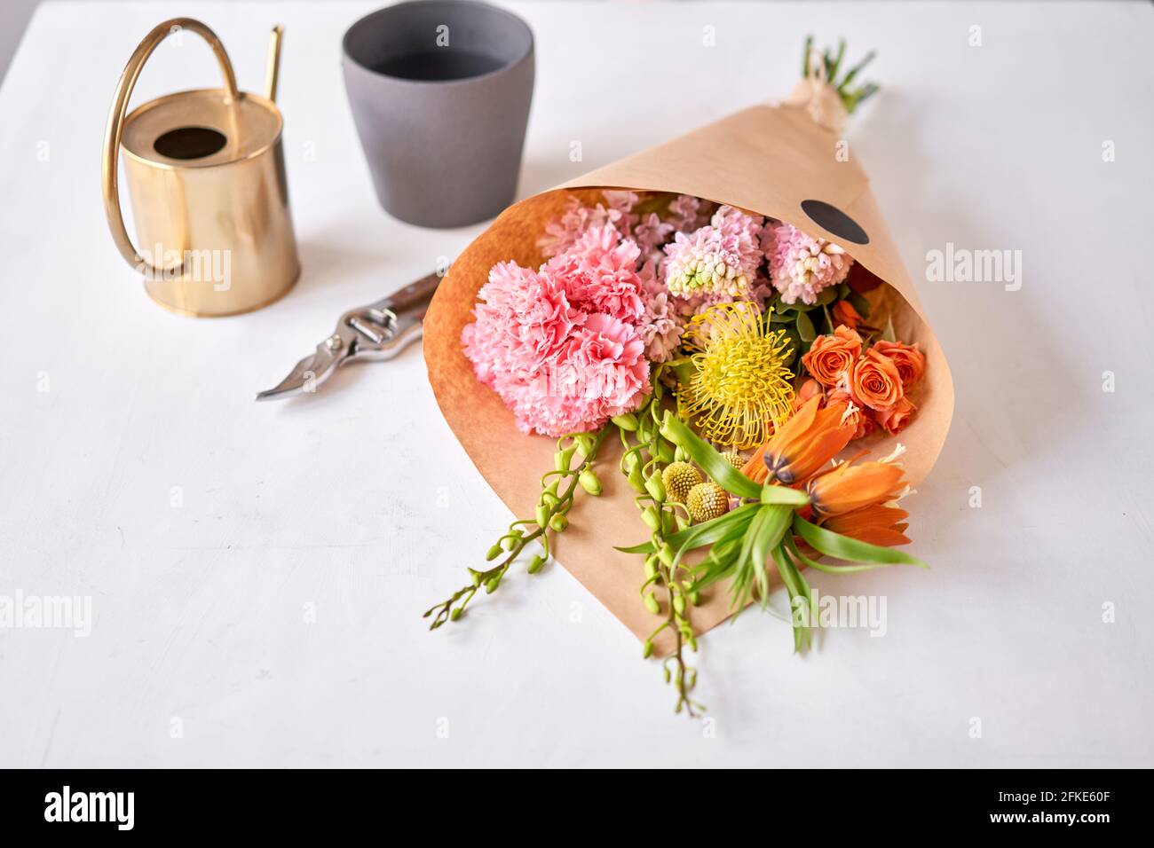 Flowers bunch, set for home. Fresh cut flowers for decoration home. European floral shop. Delivery fresh cut flower. Stock Photo