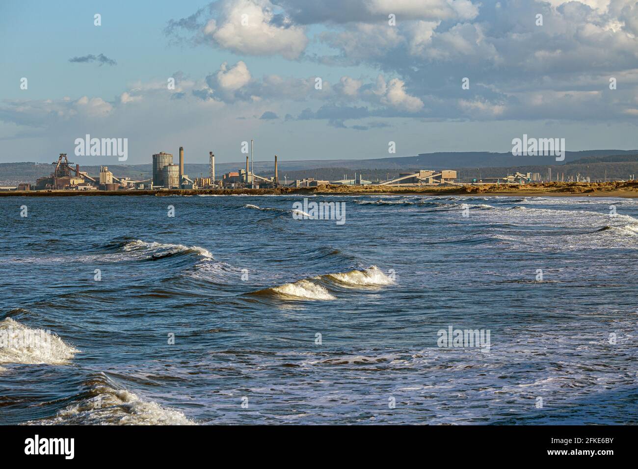 North sea with the Redcar steelworks in distance , England, UK Stock Photo