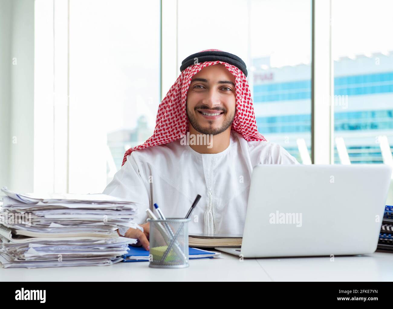 The arab businessman working in the office Stock Photo - Alamy