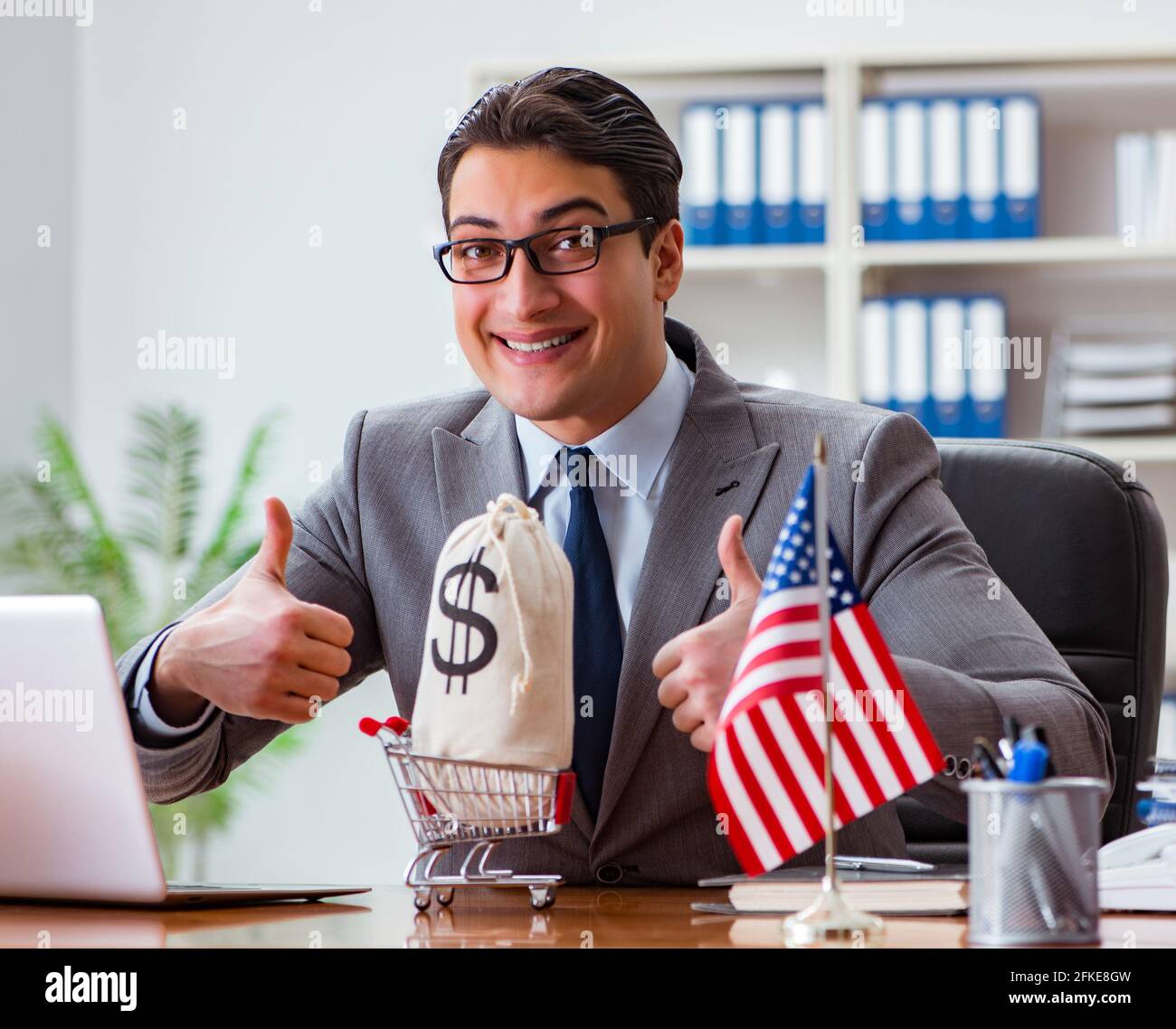 The businessman with american flag in office Stock Photo - Alamy