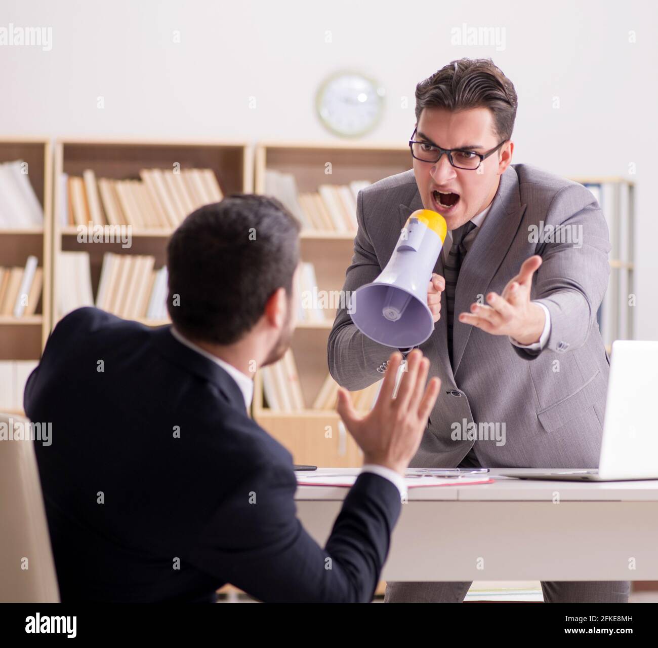 The angry boss shouting at his employee Stock Photo - Alamy