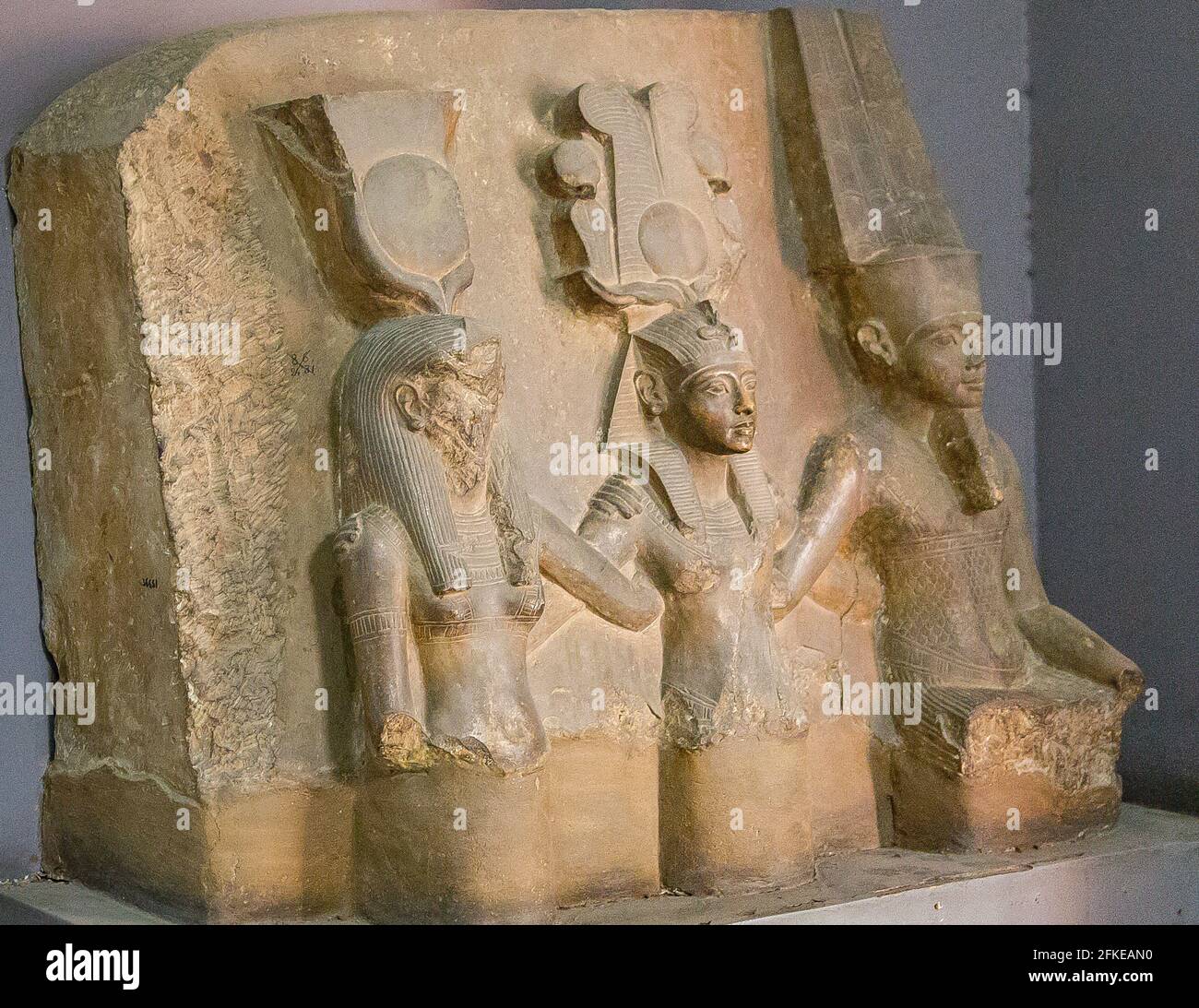 Egypt, Cairo, Egyptian Museum, limestone statue group of the king Tutankhamun between god Amon and goddess Mut.  From the Karnak cachette. Stock Photo