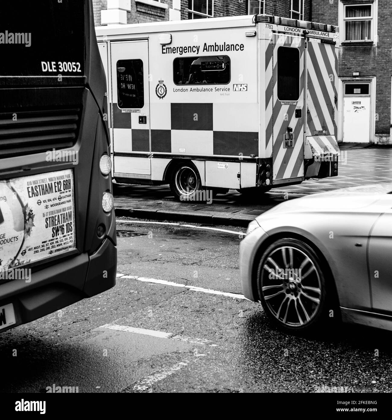 Kingston Upon Thames, London UK, A Car Bus And Ambulance On A High Street, CLose Up With No People Stock Photo