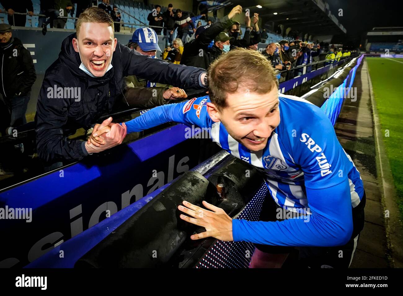 EINDHOVEN, NETHERLANDS - APRIL 30: Supporters of FC Eindhoven celebrating the victory with Joey Sleegers of FC Eindhoven during the Keuken kampioen di Stock Photo