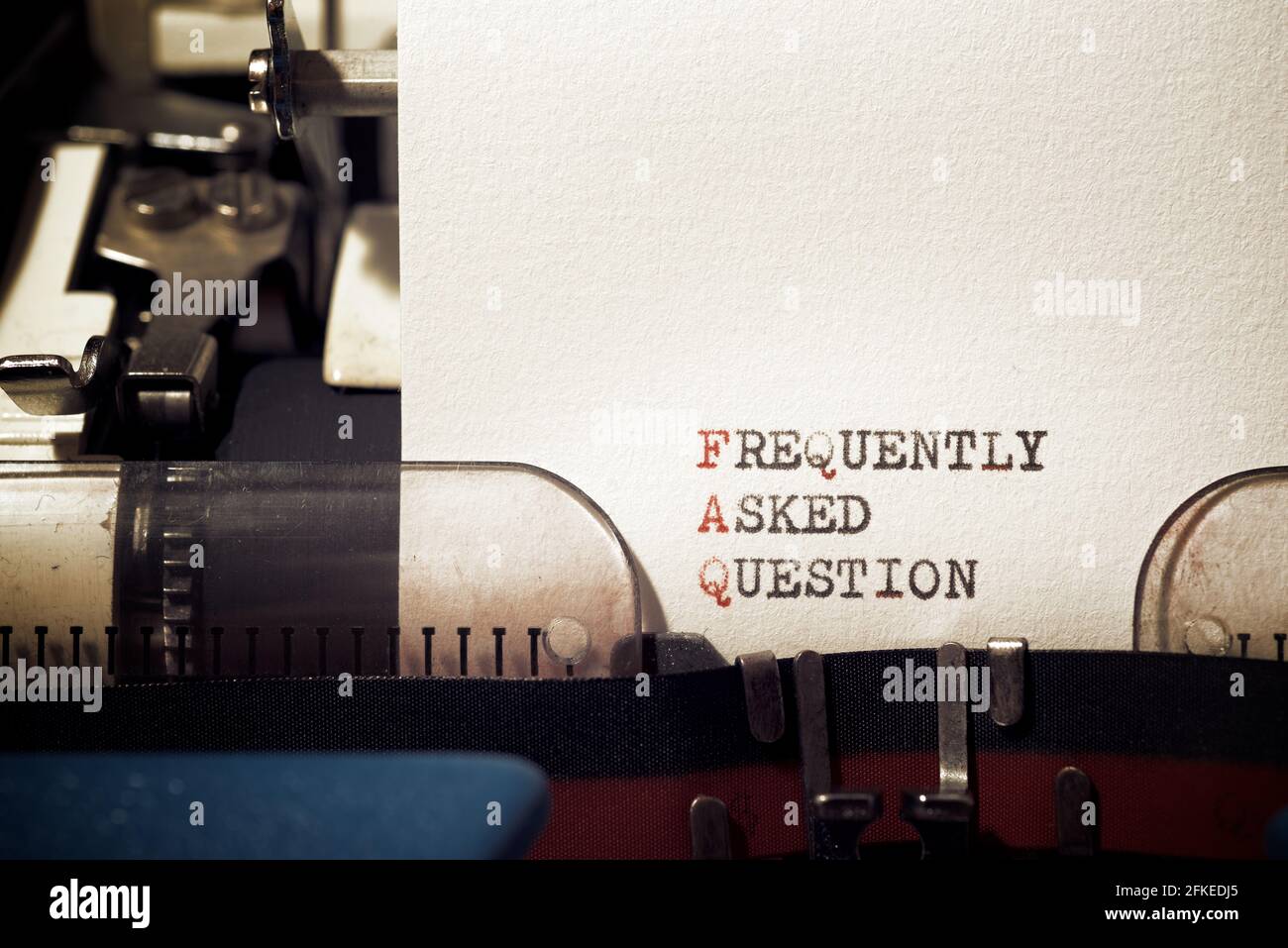 Frequently asked question phrase written with a typewriter Stock Photo ...