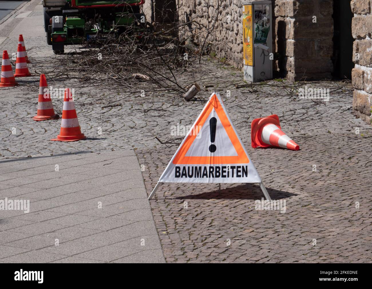 Warning sign tree work in german Stock Photo
