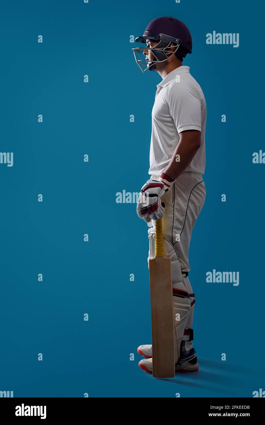 Cricketer holding a bat Stock Photo