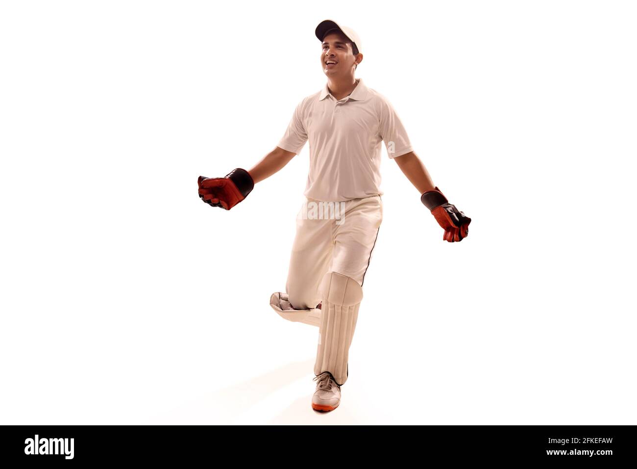 Cricketer, Wicket keeper celebrating Stock Photo Alamy