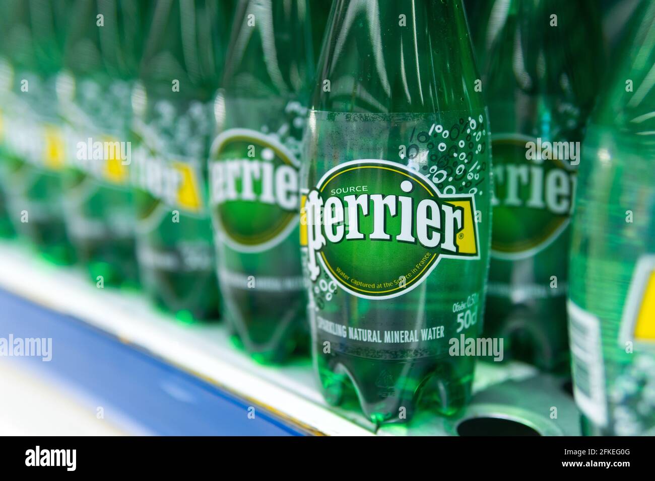 Tyumen, Russia-april 21, 2021: mineral water bottles Perrier. French brand of premium mineral water. Selling in the hypermarket Stock Photo