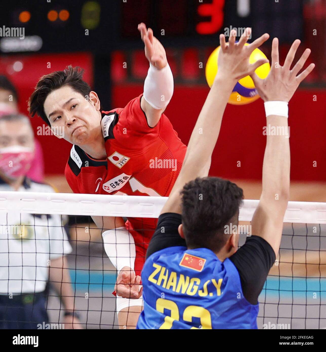 Japan's Yuji Nishida (top) spikes during the second set of a men's