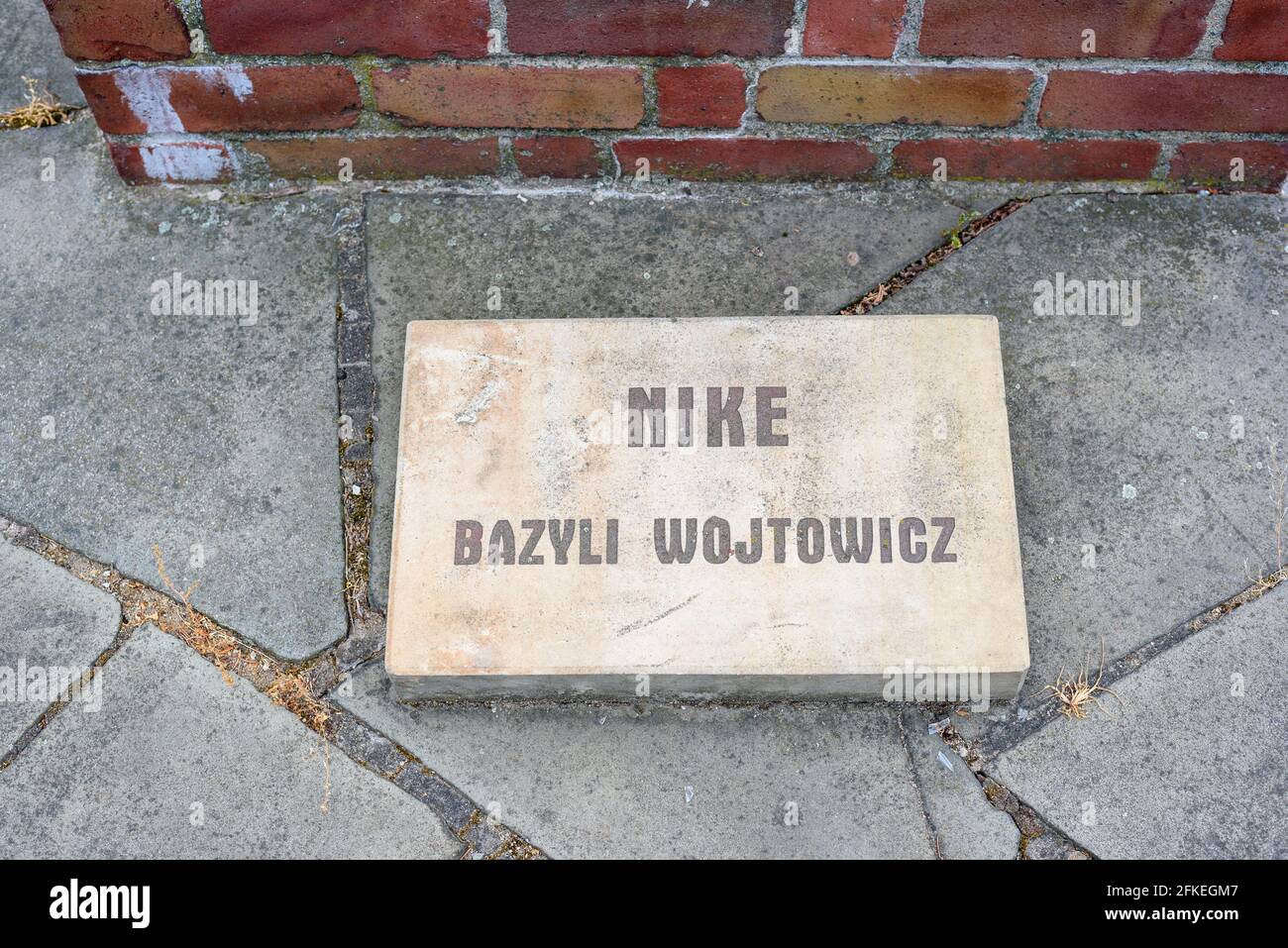 Poznan, wielkopolskie, Poland, 06.07.2019: An inscription stone next to the  sculpture of Nike by Bazyli Wojtowicz in the Cytadela Park, Poznan, Polan Stock Photo