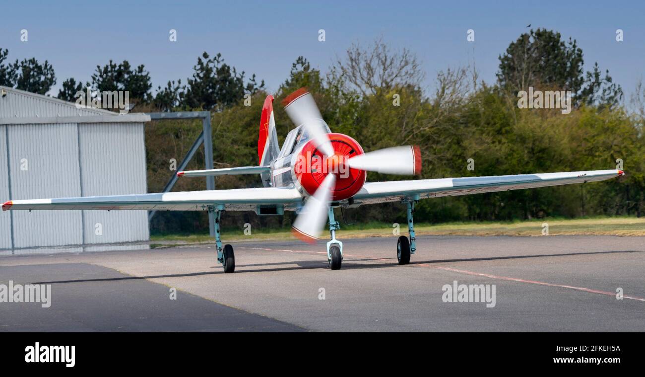 North Weald Airfield, Essex, Bacau Yak-52 C/N 9010308 on the taxiway Stock Photo