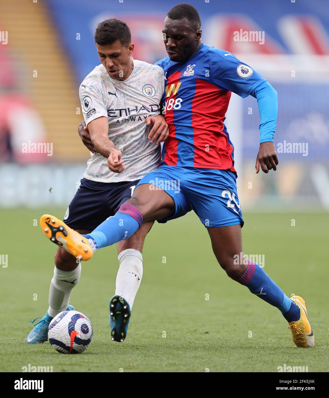 Manchester City's Rodri and Crystal Palace's Christian Benteke (right) battle for the ball during the Premier League match at Selhurst Park, London. Issue date: Saturday May 1, 2021. Stock Photo