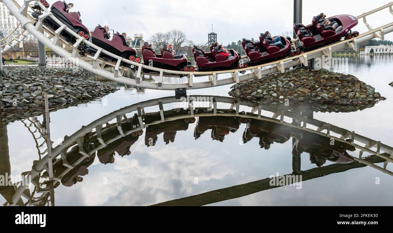 Soltau Germany. 01st May 2021. Visitors ride a roller coaster at