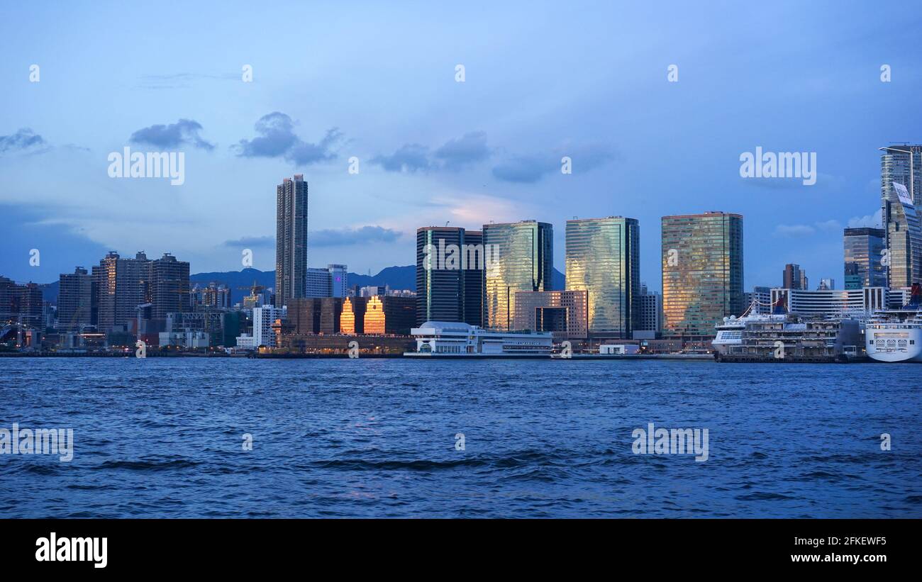 sunset view in Hong Kong, Kow Loon district, Central district in Hong Kong. Victoria Harbour. Illustrative editorial Stock Photo