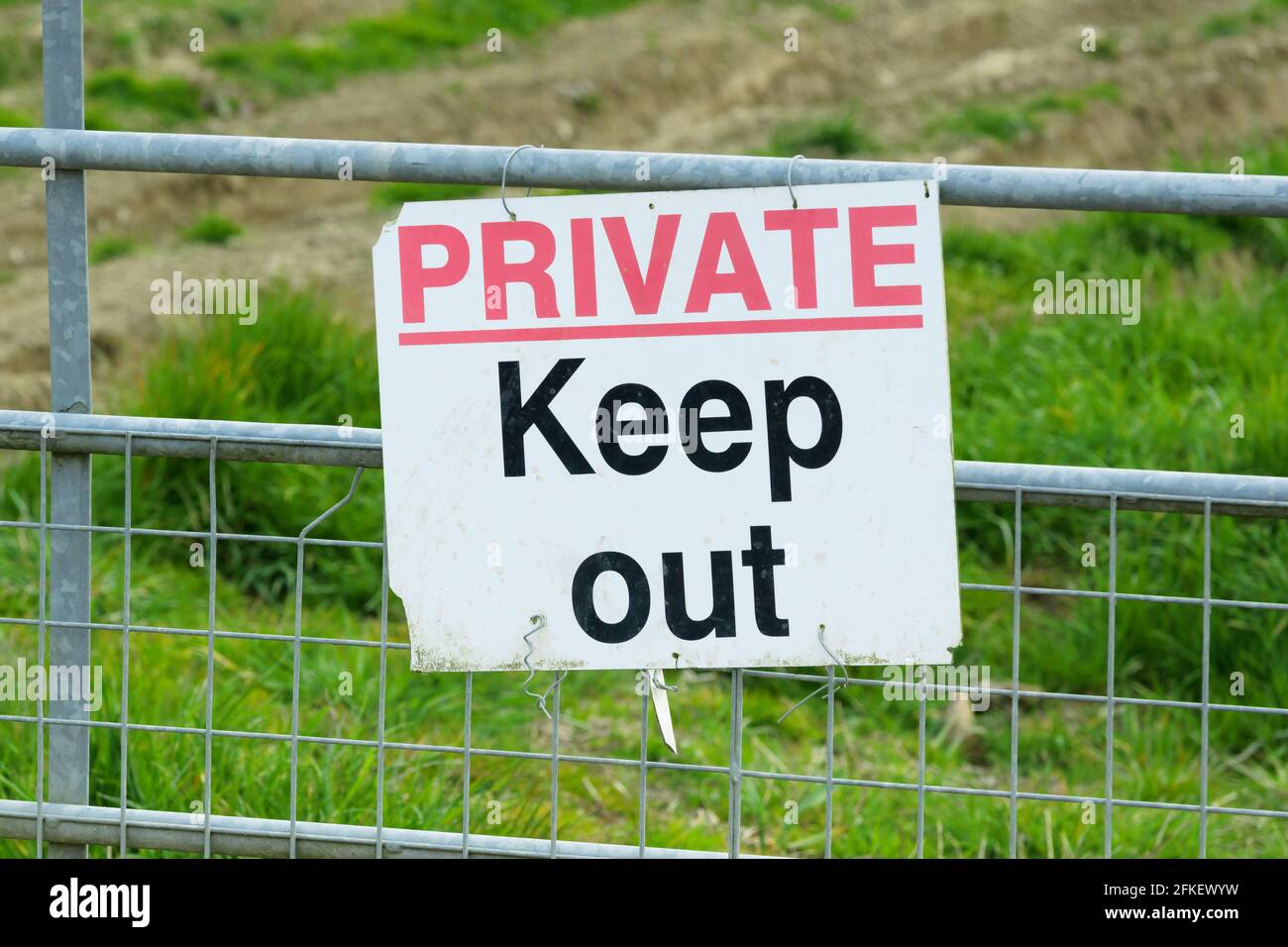 Private keep out sign on a farm gate in the UK Stock Photo