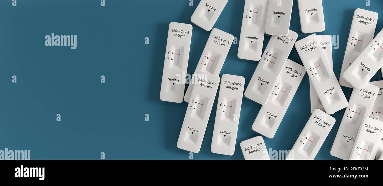 Mass testing for Covid19 / SARSCoV2 infection concept Several rapid antigen test kits. One