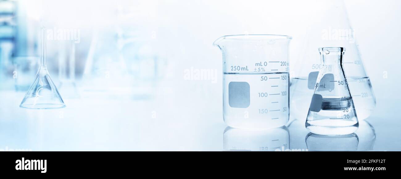 flask with clear beaker and glassware in medical science lab banner ...