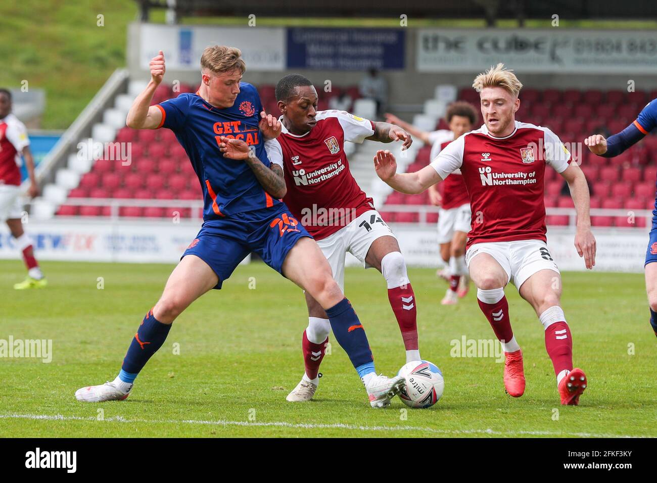 NORTHAMPTON, ENGLAND. MAY 1ST: Northampton Town's Mickel Miller is challenged by Blackpool's Daniel Ballard during the first half of the Sky Bet League One match between Northampton Town and Blackpool at the PTS Academy Stadium, Northampton on Saturday 1st May 2021. (Credit: John Cripps | MI News) Credit: MI News & Sport /Alamy Live News Stock Photo