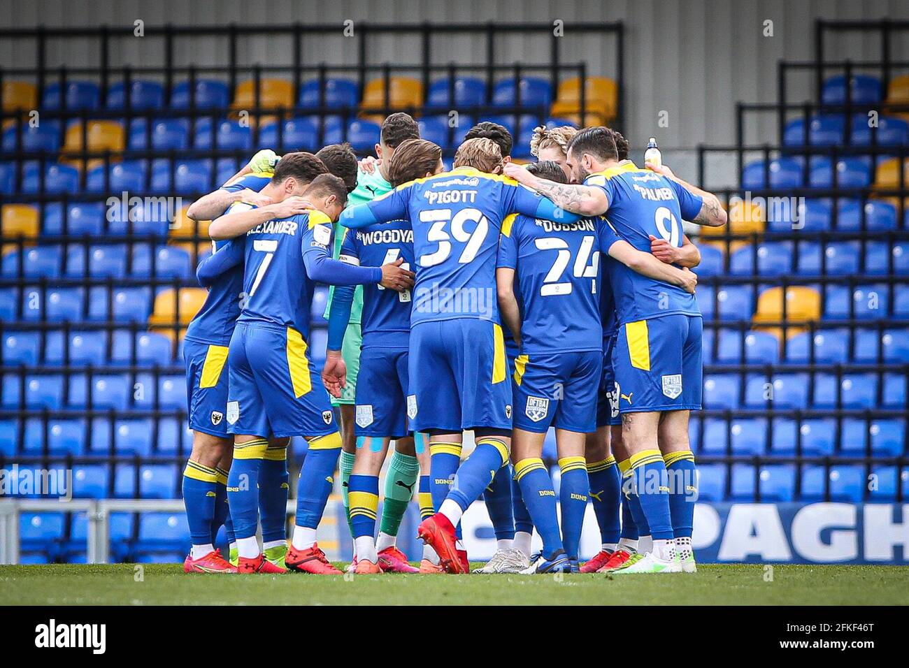 LONDON, UK. MAY 1ST AFC Wimbledon team huddle during the Sky Bet League 1 match between AFC Wimbledon and Portsmouth at the Kingsmeadow Stadium, Kingston on Saturday 1st May 2021. (Credit: Tom West | MI News) Credit: MI News & Sport /Alamy Live News Stock Photo