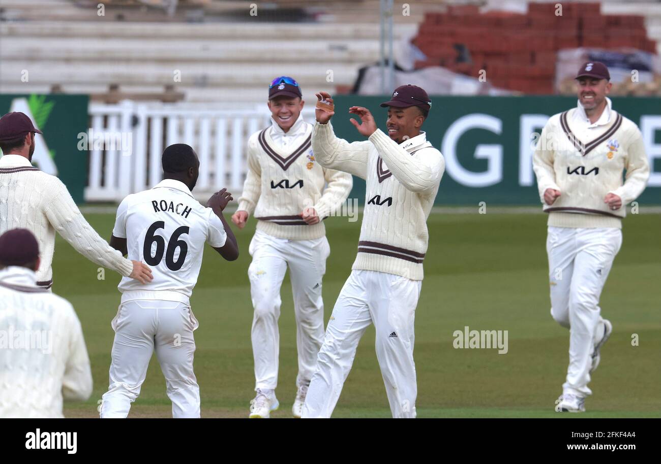 1 May, 2021. London, UK. Surrey’s Kemar Roach celebrates with team mates after getting the wicket of Hampshire’s Liam Dawson as Surrey take on Hampshire in  the County Championship at the Kia Oval, day three David Rowe/Alamy Live News Stock Photo