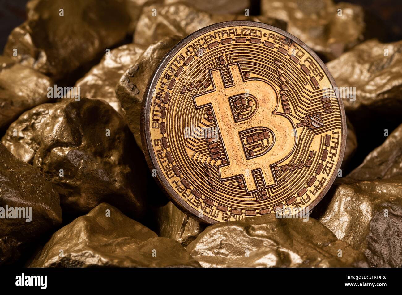 Bitcoin cryptocurrency with gold nuggets. Investment and store of value  concept Stock Photo - Alamy