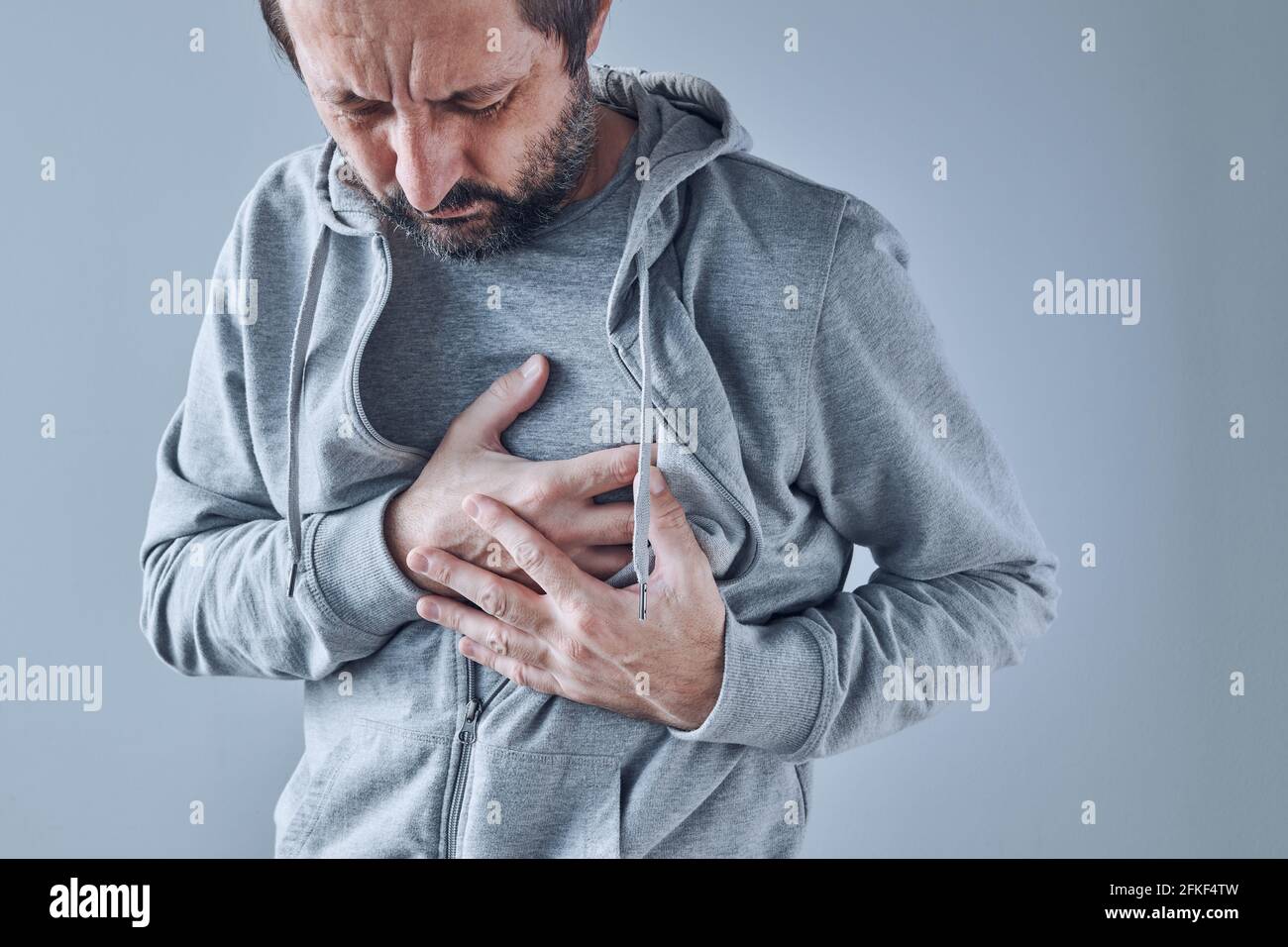 Adult caucasian male with heart problems, severe pain in chest area