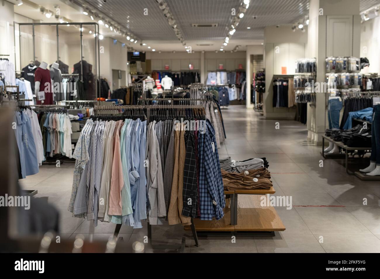 Interior of contemporary clothing store with clothes Stock Photo - Alamy