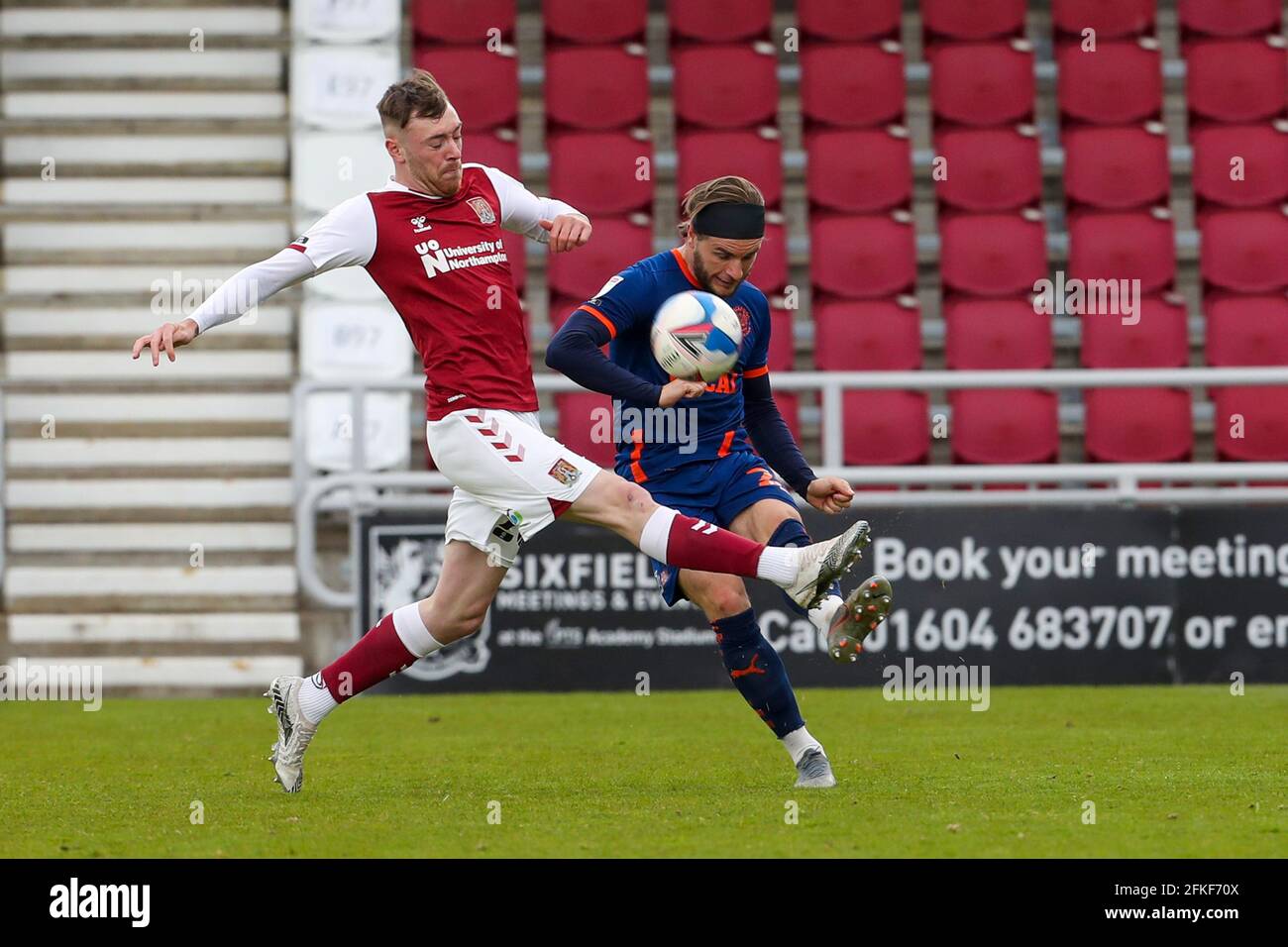 NORTHAMPTON, ENGLAND. MAY 1ST: Blackpool's Luke Garbutt is challenged by Northampton Town's Ryan Edmondson during the second half of the Sky Bet League One match between Northampton Town and Blackpool at the PTS Academy Stadium, Northampton on Saturday 1st May 2021. (Credit: John Cripps | MI News) Credit: MI News & Sport /Alamy Live News Stock Photo