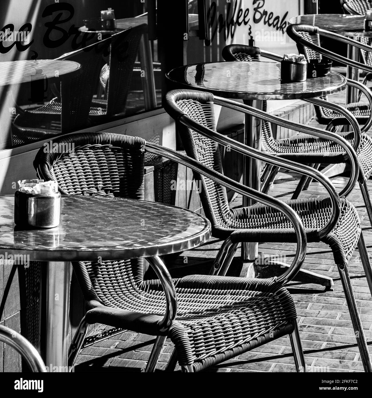 Kingston Upon Thames, London UK, April 2021, Row Of Empty Outside Cafe Or Coffee Shop Tables And Chairs With No People Stock Photo