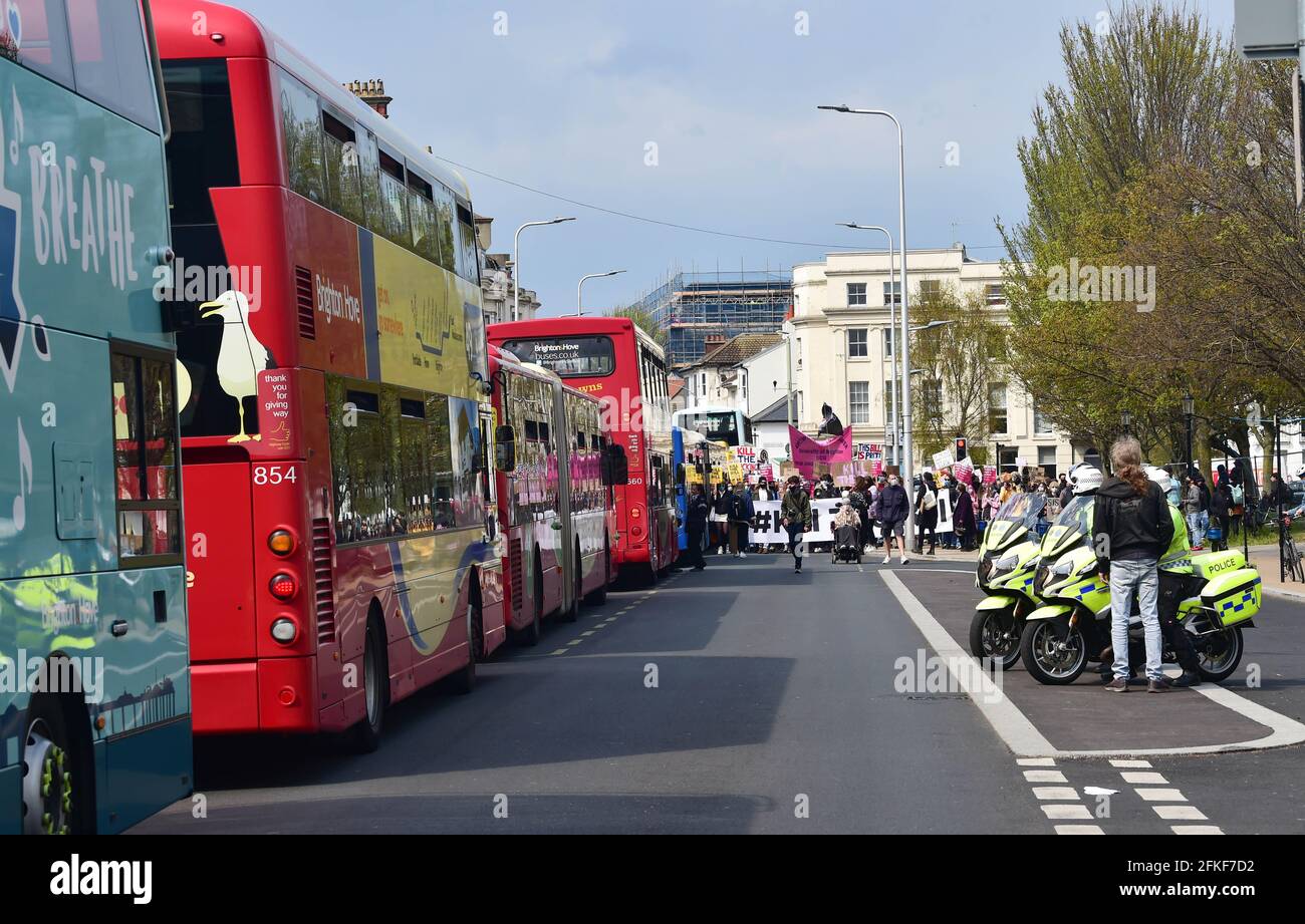 Brighton UK 1st May 2021 - Buses and traffic are held up as hundreds of Kill the Bill protesters march through Brighton today on International Workers Day as they demonstrate against the government's new Police, Crime, Sentencing and Courts bill. Demonstrations are taking place across the country on what is also known as Labour Day: Credit Simon Dack / Alamy Live News Stock Photo
