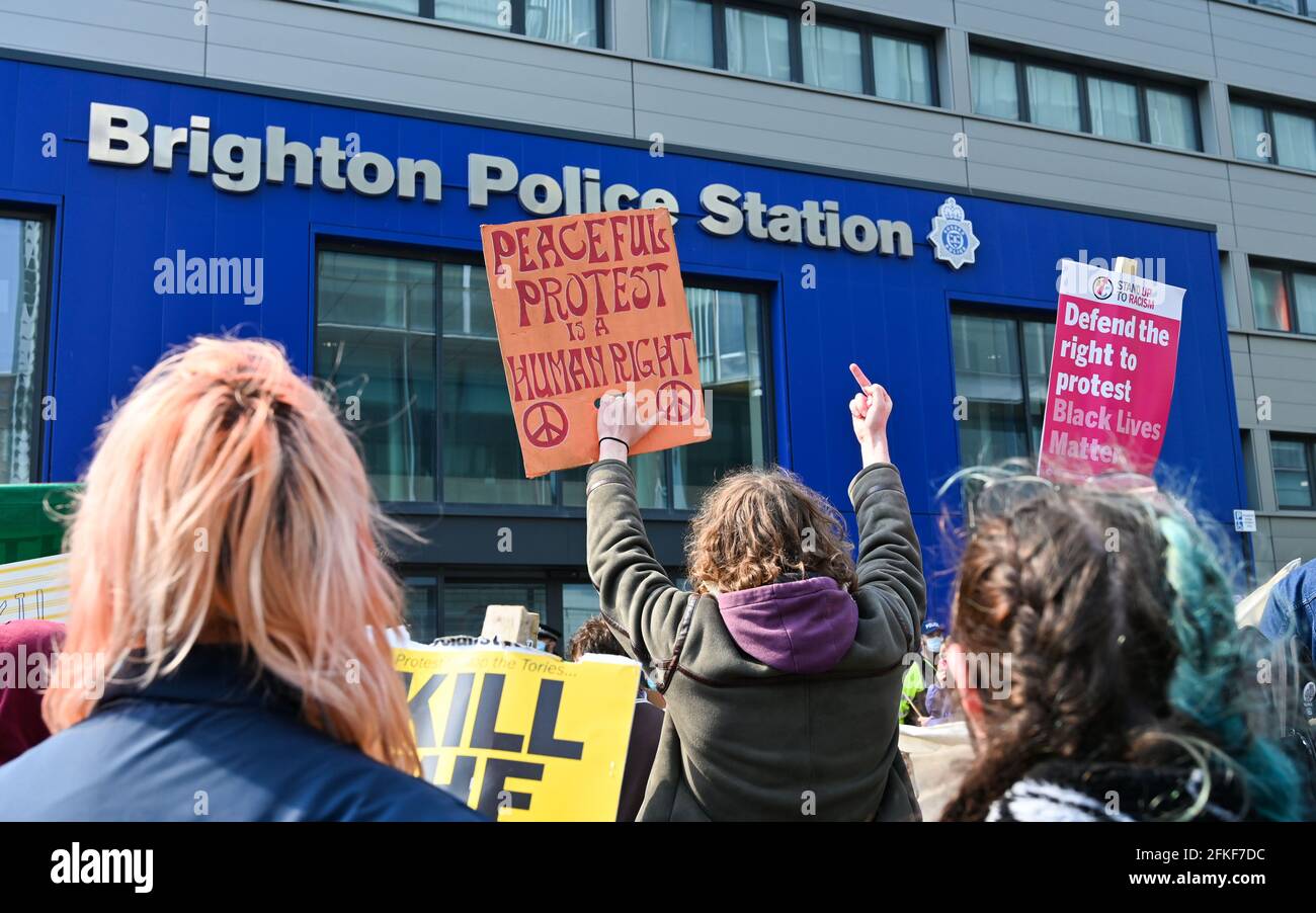 Brighton UK 1st May 2021 - Hundreds of Kill the Bill protesters outside Brighton Police Station today on International Workers Day as they demonstrate against the government's new Police, Crime, Sentencing and Courts bill. Demonstrations are taking place across the country on what is also known as Labour Day: Credit Simon Dack / Alamy Live News Stock Photo