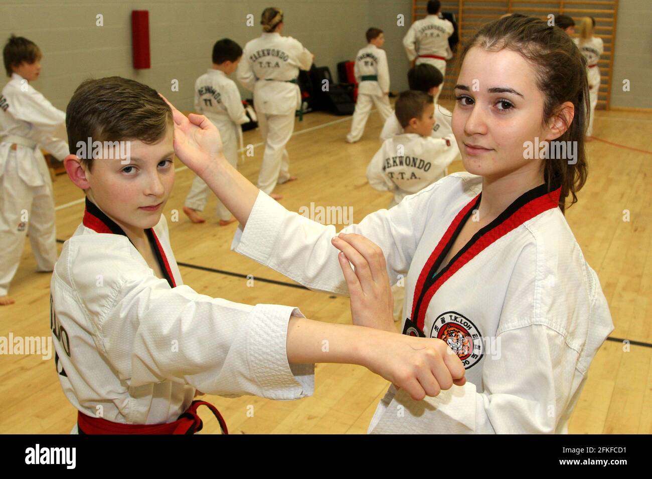 Taekwondo T.T.A at Belmont Academy.Coach / tutor Alan Brown organises  Taekwondo classes at Dalrymple, Drongon, & Belmont Academy with all ages  and families involved. Ross Duncan (12) with Nikki Kefala (14) who