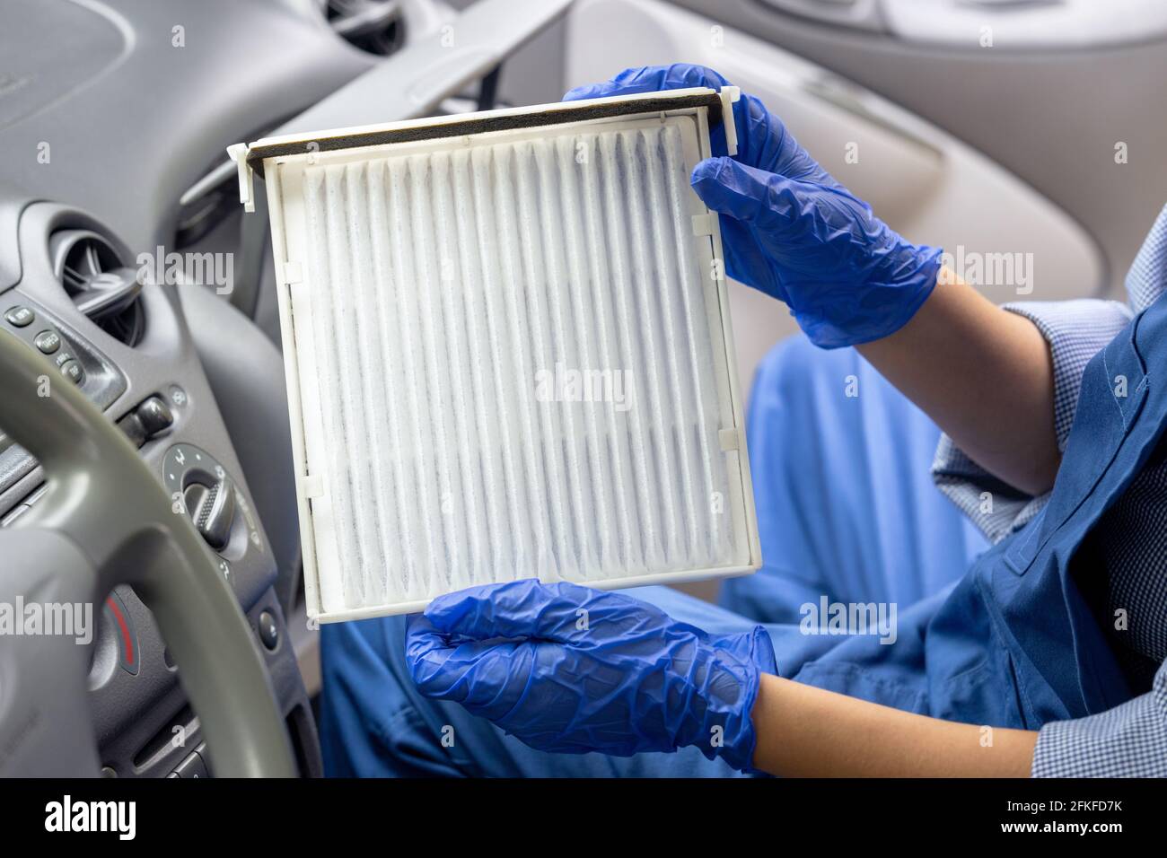 Replacement of cabin pollen air filter for a car Stock Photo Alamy