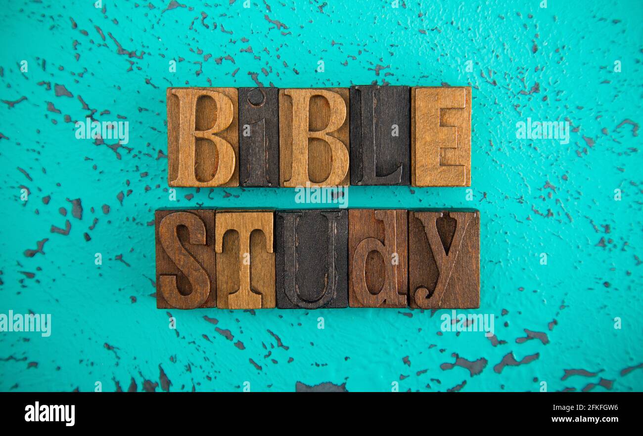 Bible Study Spelled in Wooden Type Set Block Letters on a Turquoise Background Stock Photo