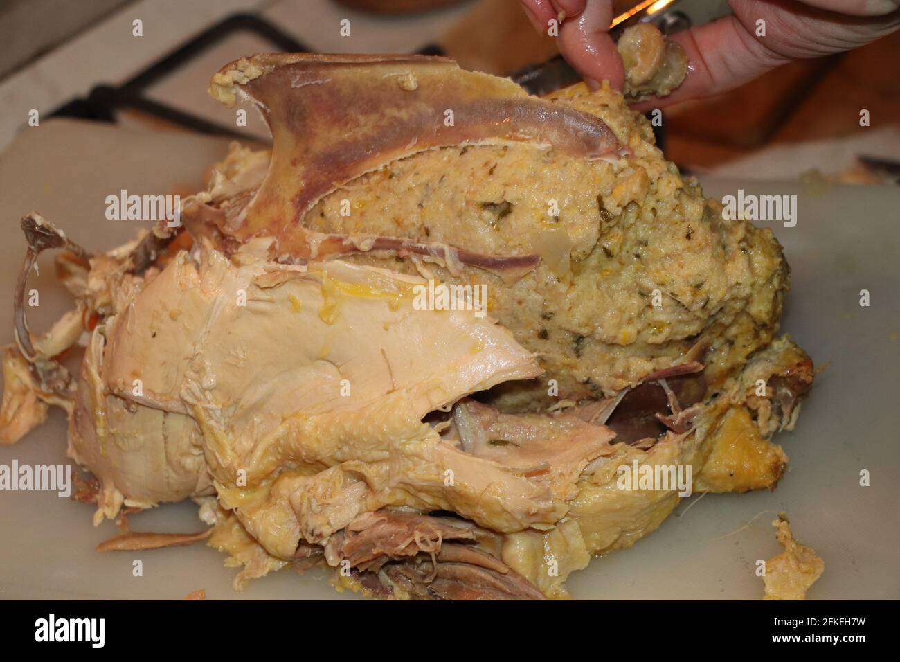 homemade stuffed capon on wooden cutting board Stock Photo
