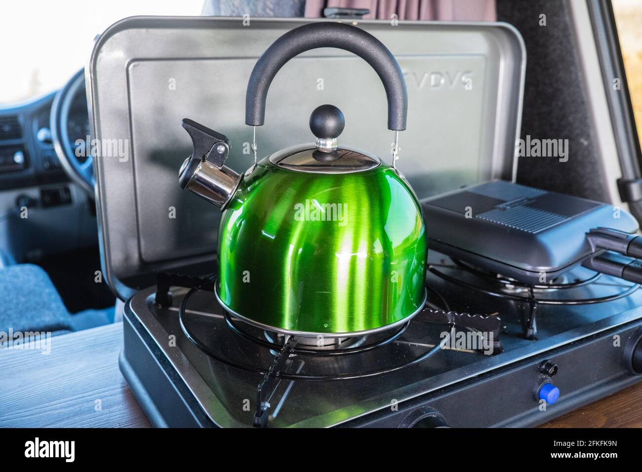 Making,a,pot,of,tea,Boiling,a,traditional,whistling,kettle,on,a,Cradoc