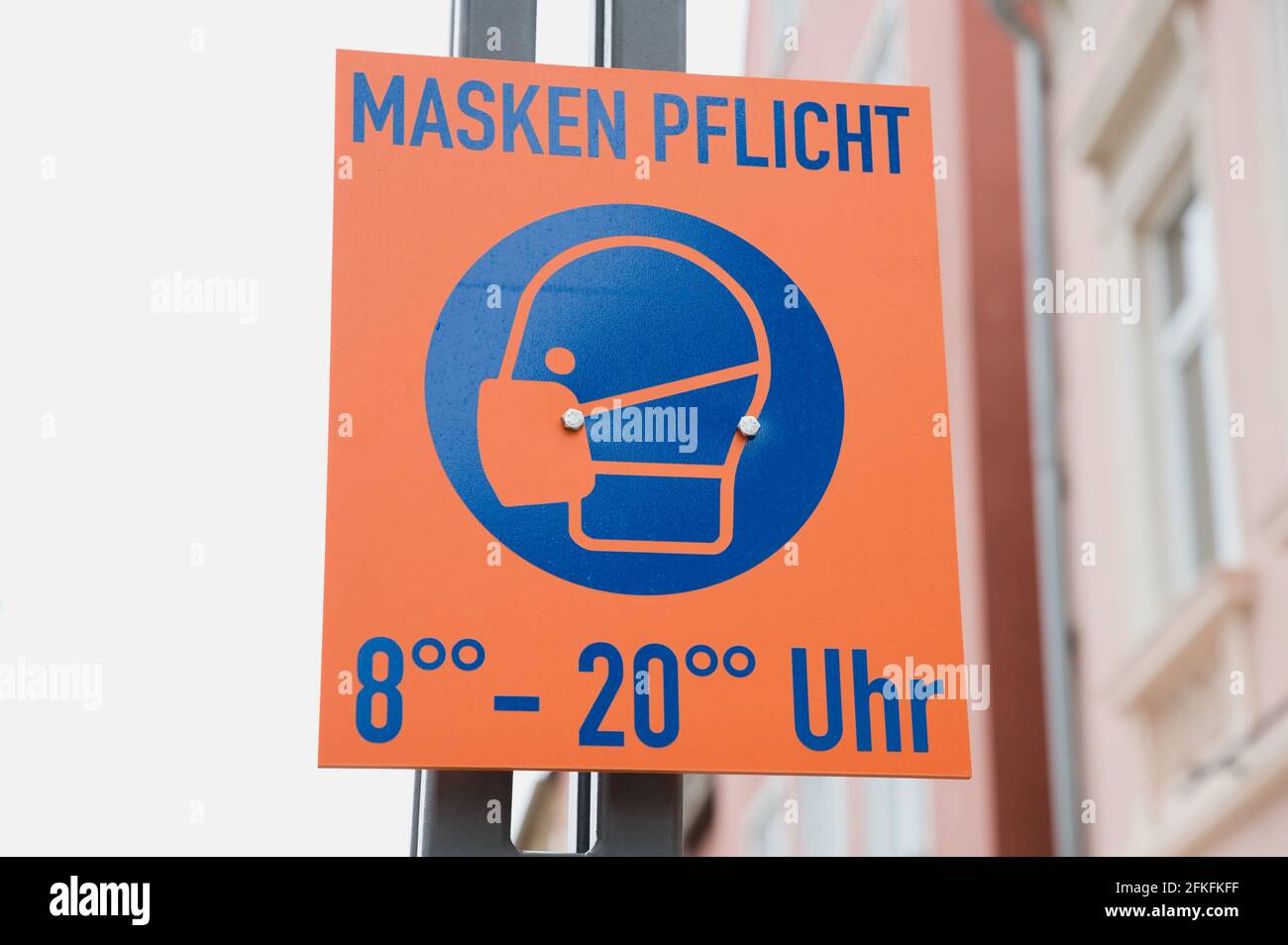 Speyer, Germany - May 01, 2021: German sign with the word 'Maskenpflicht' which means mask obligation from eight o'clock am to eight o'clock pm Stock Photo