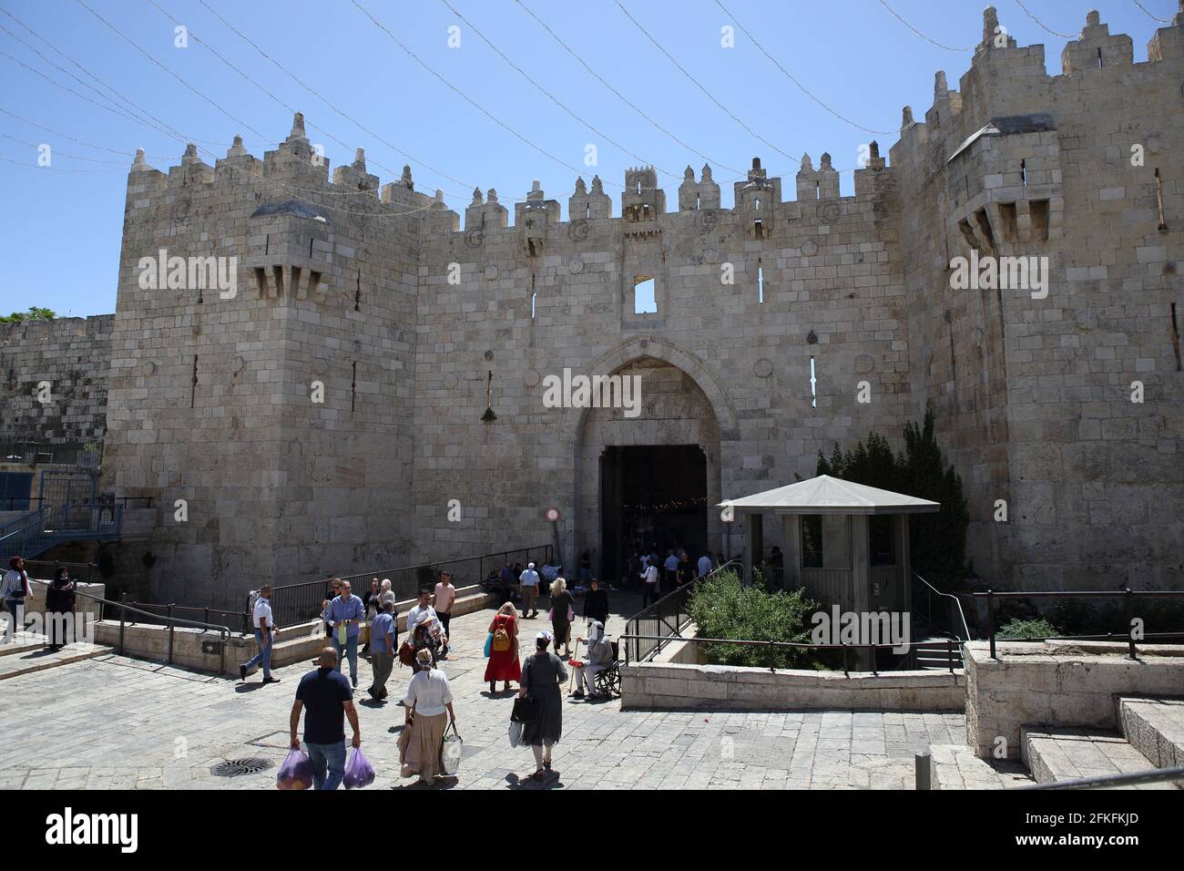 Damascus Gate, one of eight to the Old City of Jerusalem with people going into and out of the walled city. Stock Photo