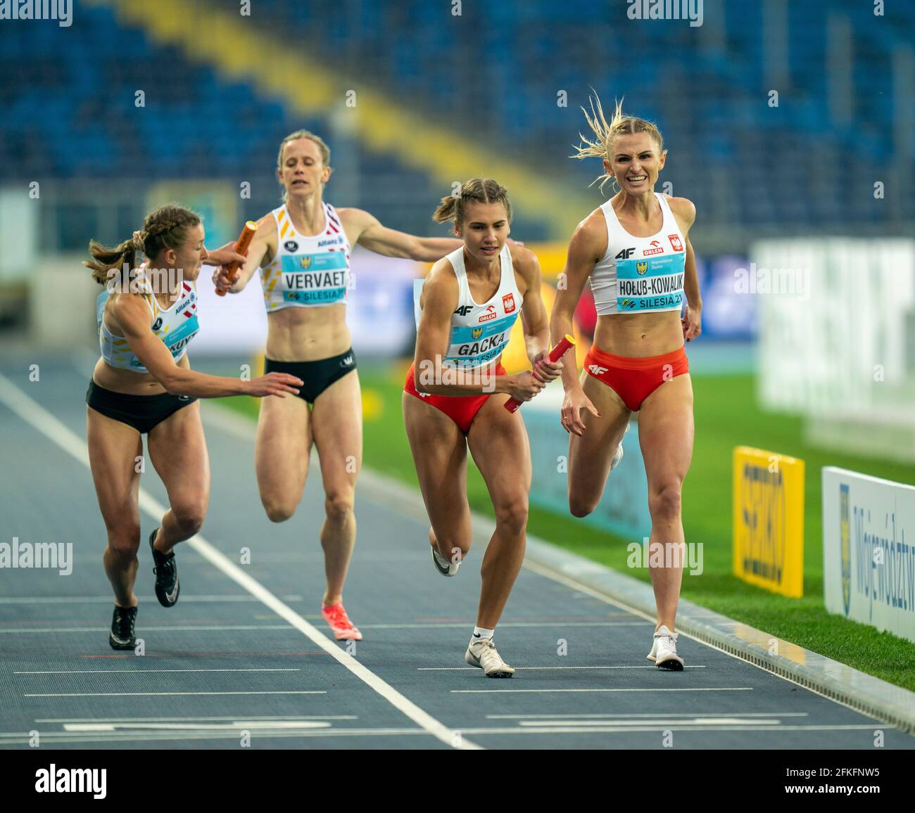 Silesian Stadium, Chorzow, Poland. 1st May, 2021. World Athletics Relays 2021. Day 1; Ladies 4x400 baton exchange as Holub-Kowalik hands to Gacka (Pol) and Vervaet hands over to Laus (Bel) Credit: Action Plus Sports/Alamy Live News Stock Photo